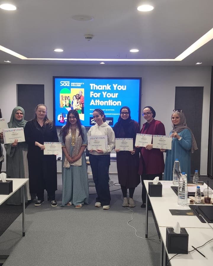 Participants with their certificates after a session at SAE University College Dubai